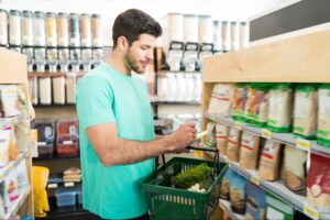 a man checking his keto grocery shopping checklists