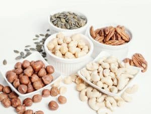 nuts and seeds on a white table