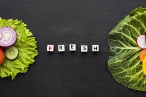 fruits and vegetables on the table with a word "fresh" on it: What is a Lazy Keto?
