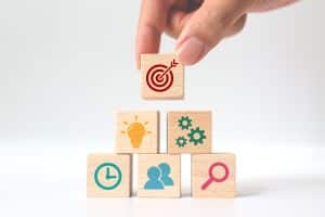 Concept of strategy to survive the hardest week of keto. Hand putting wooden cube block stacking with icon on white background